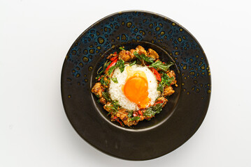 Delicious Dish with Egg on Black Plate