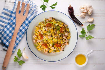 Healthy white cabbage, corn and turkey salad. Top view table with decorations.