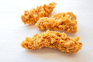 Crispy Fried chicken strips or Fried Boneless Chicken on white background 
