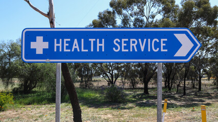 Directional road sign, to health services, small rural Outback town in Western Australia