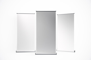 Blank Retractable Banners Displayed on a White Background. 3D Rendering