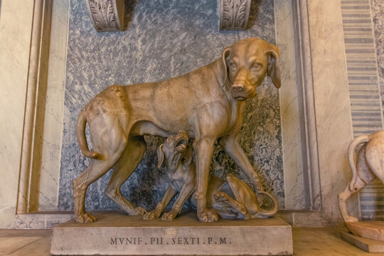 Ancient marble sculpture of a dog and its cub