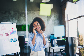 Photo of sweet charming lady assistant wear shirt listening modern gadget indoors workplace...