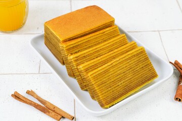 Delicious and delicate Indonesian Lapis Legit, a rich and buttery layered cake made with eggs,...