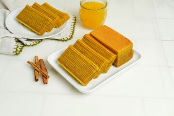 Delicious and delicate Indonesian Lapis Legit, a rich and buttery layered cake made with eggs,...