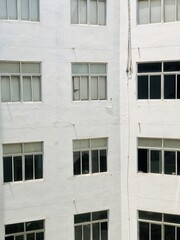 Facade of a hospital building. Hospital building exterior with windows.