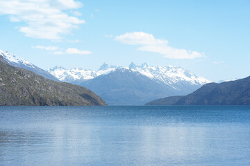 Naklejka premium Beautiful landscape of Puelo Lake -Lago Puelo-National Park during spring with blue glacial lake and snowy mountains in the background. Argentinian Andes, Chubut, Patagonia Argentina. 