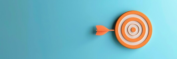 Aim target in orange on a light blue background With copy space