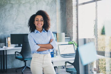Photo of cheerful positive lady recruiter dressed shirt smiling hands crossed indoors workplace...
