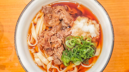 Ramen, Japanese style noodle, with soy sauce soup with meat and vegetables in white bowl 