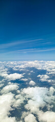 Puffy clouds with blue sky for background view from airplane