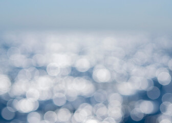 Sea. Abstract view of the blue sea with ripples on the water and white sun glare on a sunny summer...