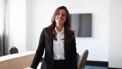 Portrait of a young businesswoman smiling, ready for a business conference
