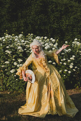 Fototapeta premium Portrait of blonde woman dressed in historical Baroque clothes with old fashion hairstyle