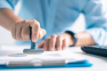 Notary placed their stamp of approval on the document as the lawyer and business person finalized...
