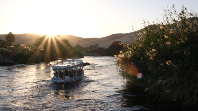 09/02/2024 ,Aswan Egypt, Tourist boats float on the Nile River, at Aswan Egypt