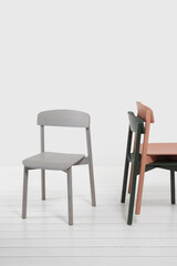 three modern design chairs with backrest in apartment interior