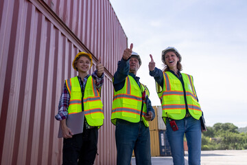 Engineer industry jackets and hard hats standing in an industrial area, refinery or power plant....
