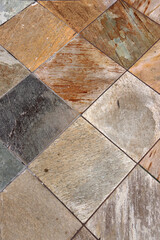 Floor tiled with multi-colored stone materials