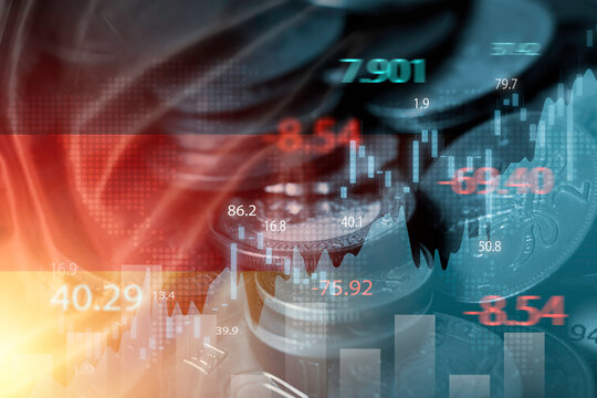 Double exposure of Germany flag on coins stacking and stock market graph chart .It is symbol of Germany high growth economy and investment technology concept.