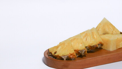 fresh juicy pineapple pieces isolated on white background