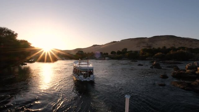 09/02/2024 ,Aswan Egypt, Tourist boats float on the Nile River, at Aswan Egypt