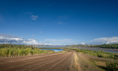 Dempster Highway approaching the Mackenzie and Arctic Red Rivers at the hamlet of Tsiigehtchic,...