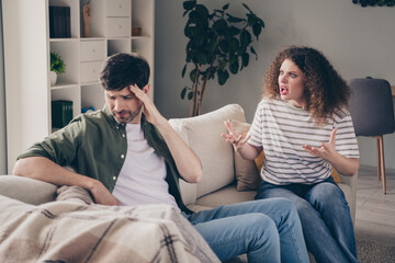 Photo of two young people sit couch yell complain argue modern interior apartment indoors