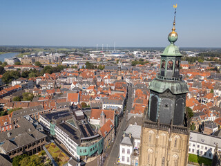 Obraz premium Aerial drone photo of a church tower in the city Zutphen in the Netherlands