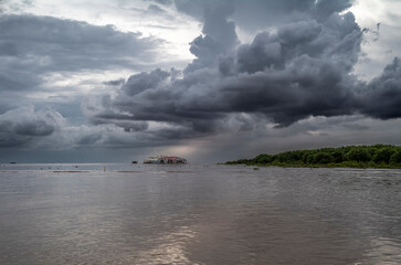 Fototapeta premium Monsoon rain clouds before a thunderstorm on the Tonle Sap lake in Cambodia
