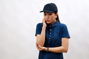 Beautiful asian woman courier wearing delivery uniform looking stressed and nervous with hands on mouth biting nails. anxiety problem.