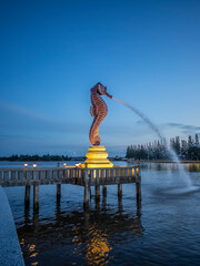The Seahorse monument on the Praek Tuek Chhu River in Kampot in Cambodia at sunset © gdefilip