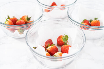 Fresh and Moldy Strawberries in a Glass Bowl on a White Napkin