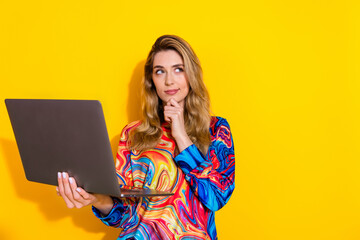 Photo portrait of pretty young girl hold netbook minded look empty space wear trendy colorful...