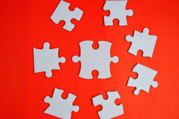 white jigsaw puzzle with missing puzzle for a text template. Above photo of isolated on the purple background