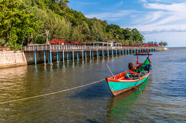 Fishing boats and crab fishing traps moored on the coast of Kep in Cambodia