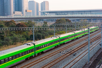 China Railway, green train running at the railway station