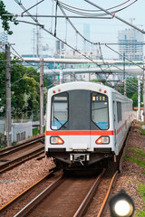 Naklejka premium A subway train running on ground tracks in Shanghai, China.
