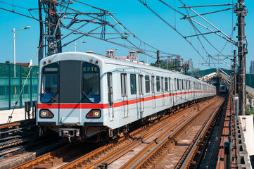 A subway train traveling on an elevated track in Shanghai, China.