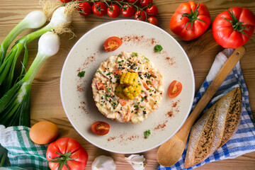 Russian salad with potato, corn and mayonnaise. Top view table with  decoration.
