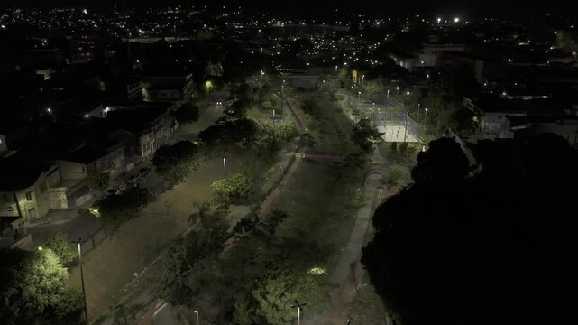 Drone flies over Parque Elsa Sim&otilde;es at night in Manaus, Amazonas, Brazil