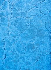 abstract line pattern on blue painted part of conrete with cracks