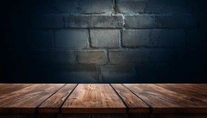 Old wood table with blurred concrete block wall in dark room background.