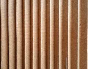 Obraz premium Paper cardboard background. Natural corrugated carton sheet. Kraft cardboard texture with vertical stripes.