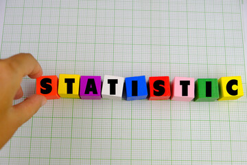 statistic words from colorful wooden blocks with letters, learning and education concept, bright background