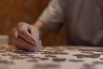 putting puzzles into a picture close-up, retired hobby