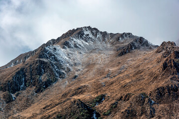 Peak with a small amount of snow in the plateau area in autumn