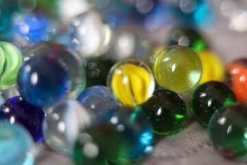 Colorful marbles close-up macro photography. Selective focus.