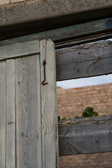 The doors of the back entrance to an abandoned, rustic store