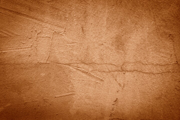 An abstract brown wallpaper featuring a beautiful decorative stucco surface with copy space for design